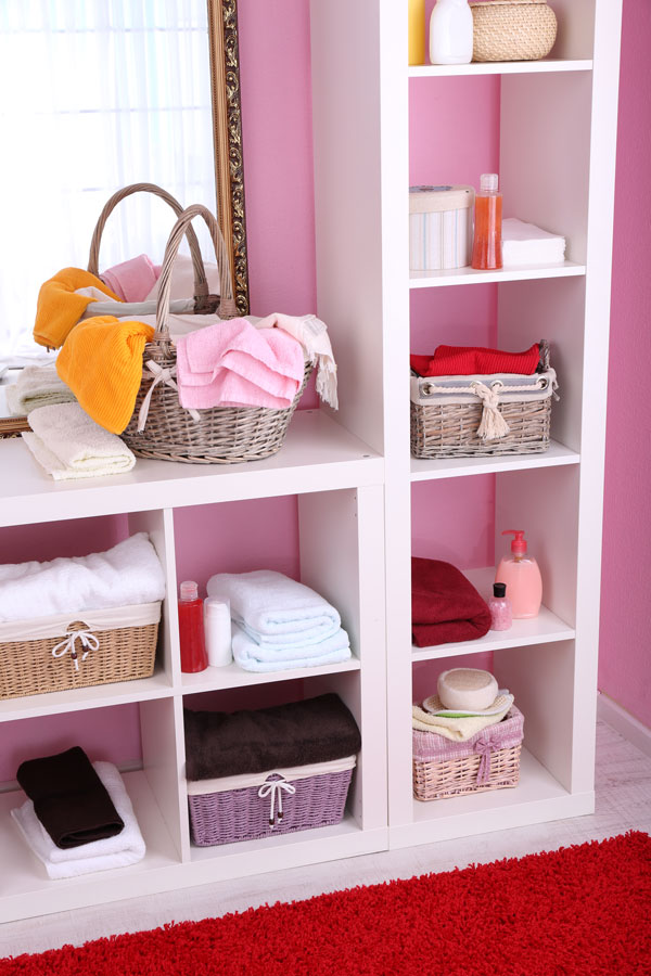 organizational cabinets in a pink room