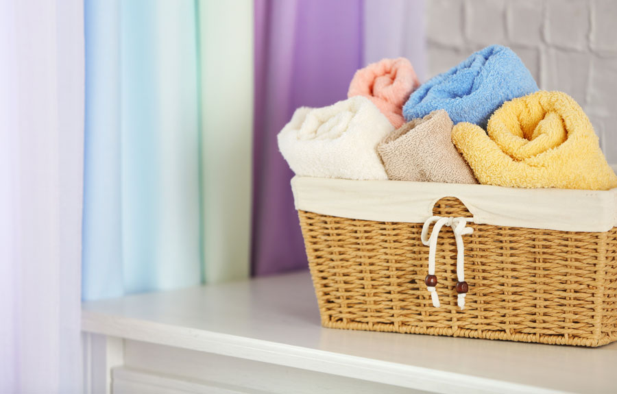 small basket with multi-colored towels